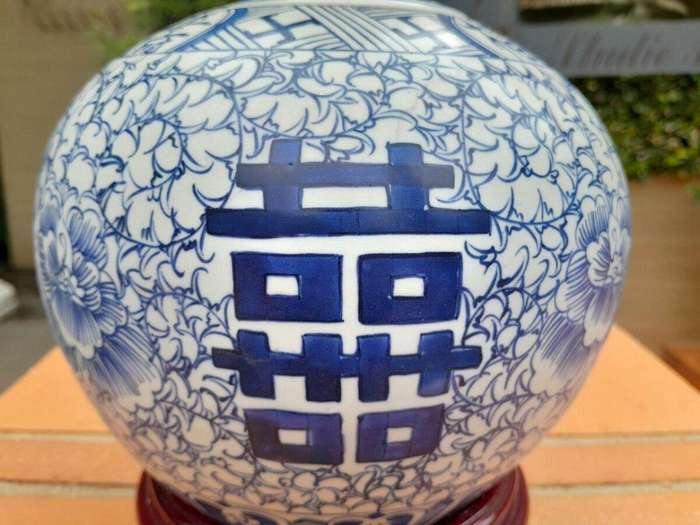 A Blue and White Porcelain Chinese Lidded Jar on Wooden Stand