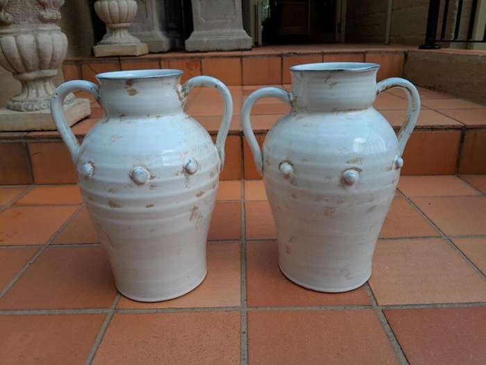 A Pair Of Large Ceramic Urns With Two Handles