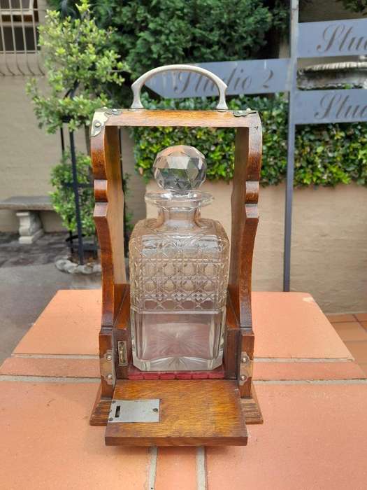 An Antique Victorian Tantalus With A Crystal Decanter And Key