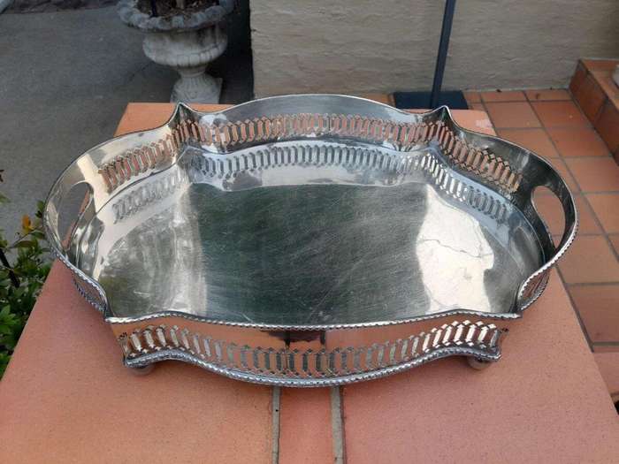 A Silver-Plate Gallery Tray On Bun Feet