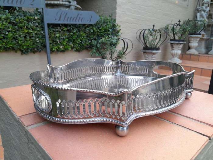 A Silver-Plate Gallery Tray On Bun Feet