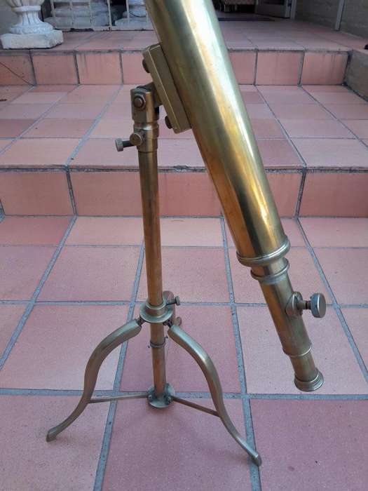 An Antique Brass Table Top Telescope On Tripod Base