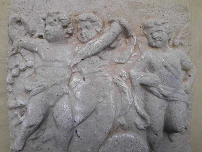 A Concrete Relief Plaque Sculpture With 3 Putti (Cherubs) In A Mythological Scene