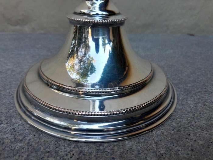 A 20th Century Pair Of Electroplate Candlesticks