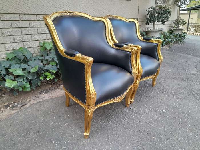 A 20th Century French Style Pair Of Carved Gilt Wood Armchairs