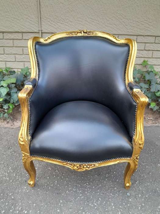 A 20th Century French Style Pair Of Carved Gilt Wood Armchairs