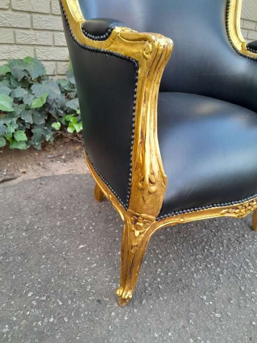 A 20th Century French Style Pair Of Carved Gilt Wood Armchairs