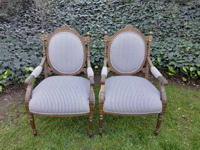 A Pair of 20th Century French Louis XV Style Gilded Armchairs Upholstered in a Ticking Fabric