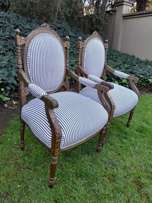A Pair of 20th Century French Louis XV Style Gilded Armchairs Upholstered in a Ticking Fabric