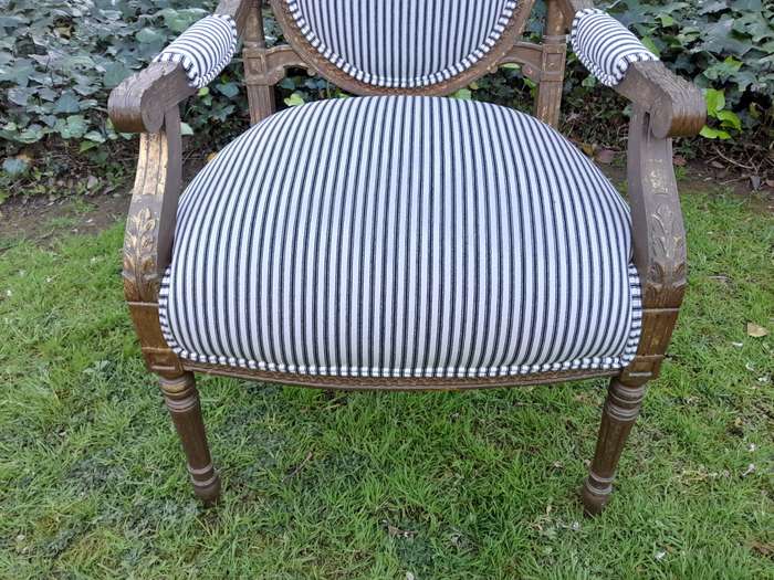 A Pair of 20th Century French Louis XV Style Gilded Armchairs Upholstered in a Ticking Fabric