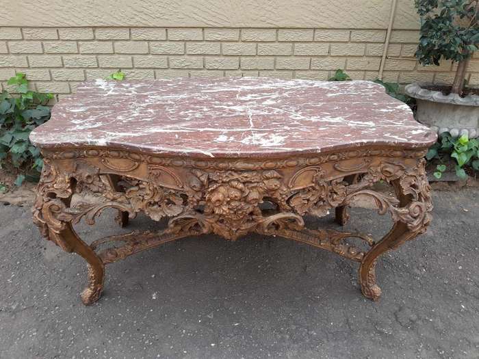 An 18th Century French Louis XV Ornately Carved and Gilded Console / Drinks Table with Marble Top