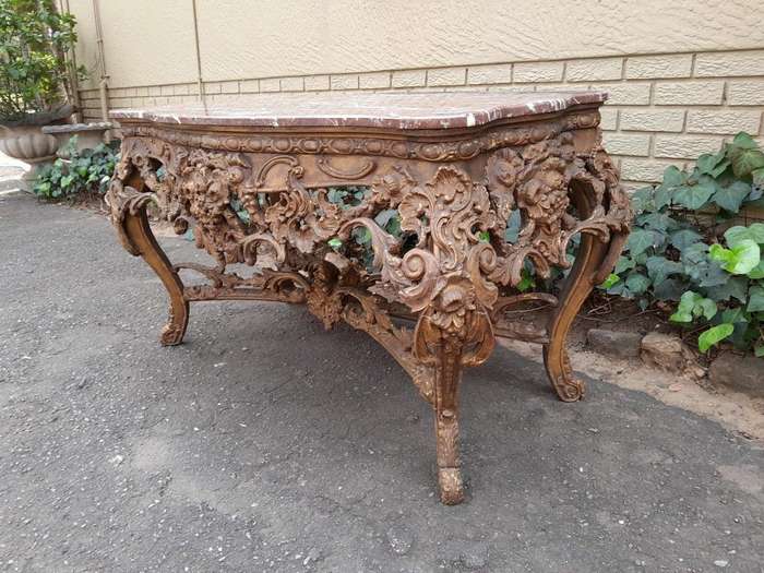 An 18th Century French Louis XV Ornately Carved and Gilded Console / Drinks Table with Marble Top