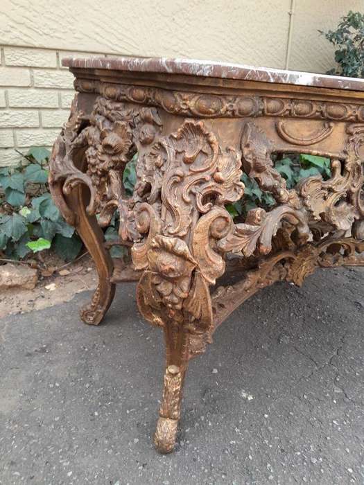 An 18th Century French Louis XV Ornately Carved and Gilded Console / Drinks Table with Marble Top