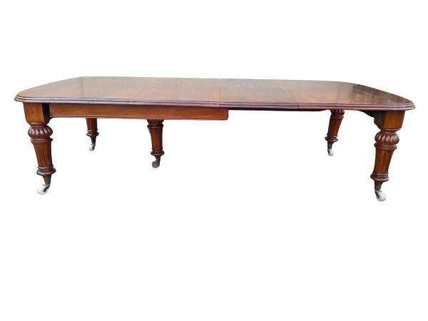 An Antique Victorian Oak Dining Table on Porcelain Castors with Two Leaves (10 Seater)