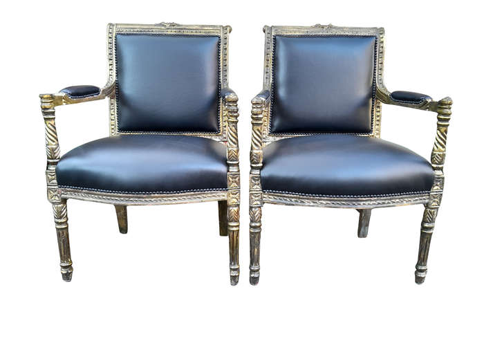 A Pair Of Louis XVI Style Carved And Gilded Armchairs Upholstered in Leather