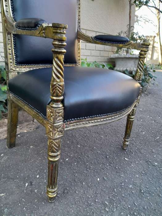 A Pair Of Louis XVI Style Carved And Gilded Armchairs Upholstered in Leather
