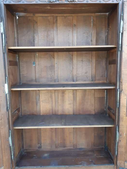 A French Provincial styled Ornately carved Armoire