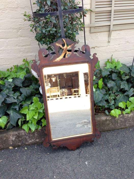 A Georgian mahogany mirror with an eagle