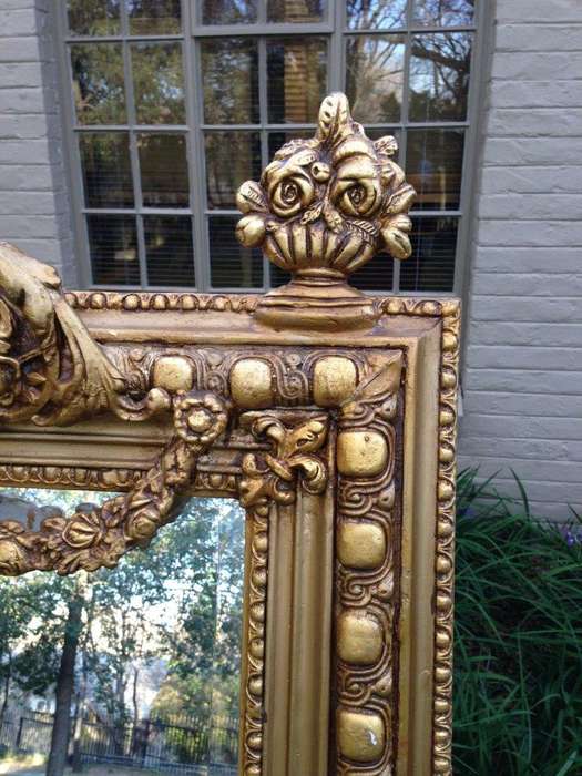 An Ornate Carved Painted Mirror