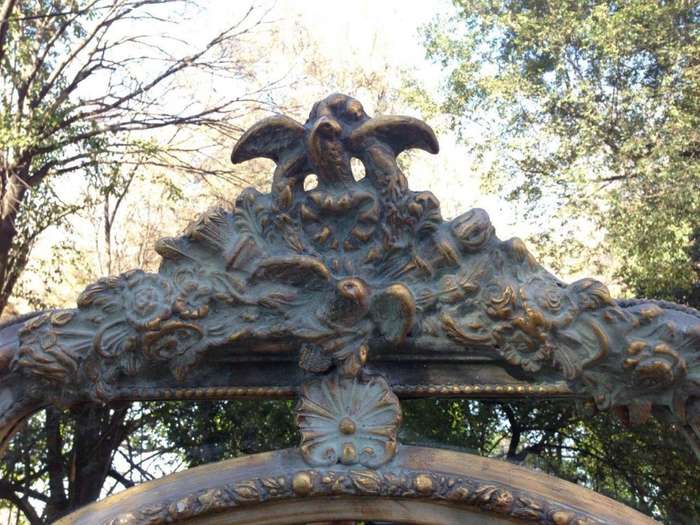 A French Ornate carved painted mirror with a bevelled centre section