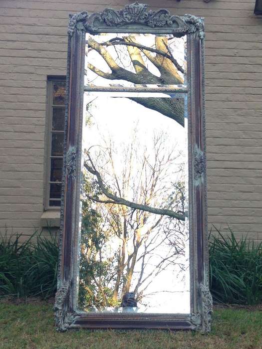 An Ornate Carved & Bevelled Painted Mirror