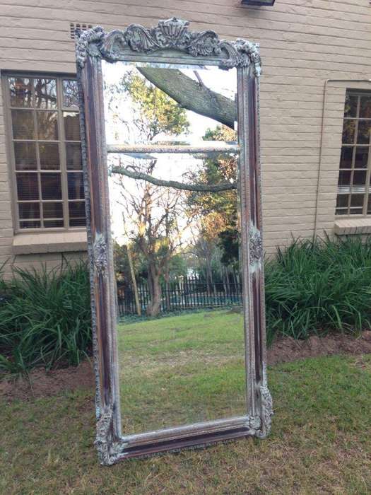 An Ornate Carved & Bevelled Painted Mirror