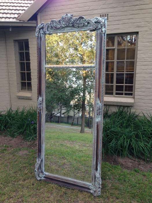An Ornate Carved & Bevelled Painted Mirror
