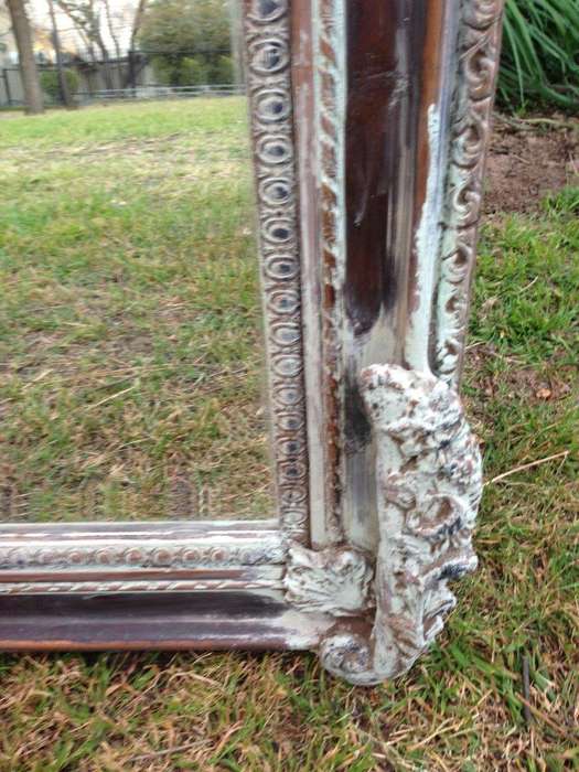 An Ornate Carved & Bevelled Painted Mirror