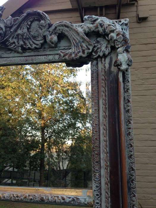An Ornate Carved & Bevelled Painted Mirror