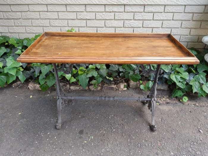 A Victorian Cast-Iron And Pine Table