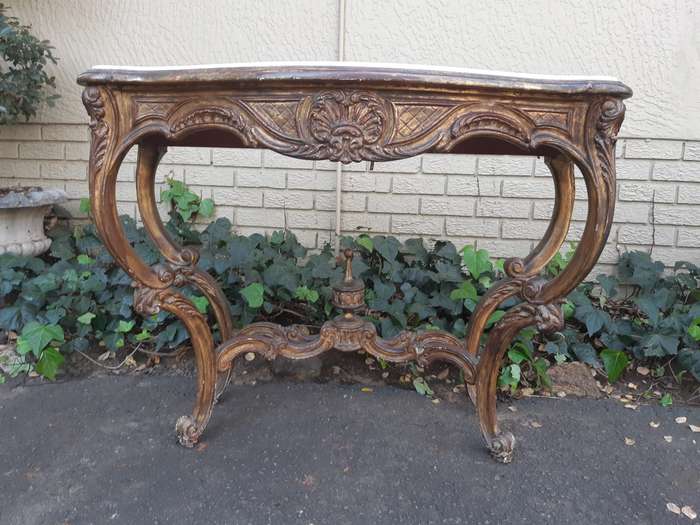 A 19th century French giltwood and marble-topped console table