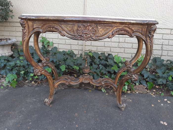 A 19th century French giltwood and marble-topped console table