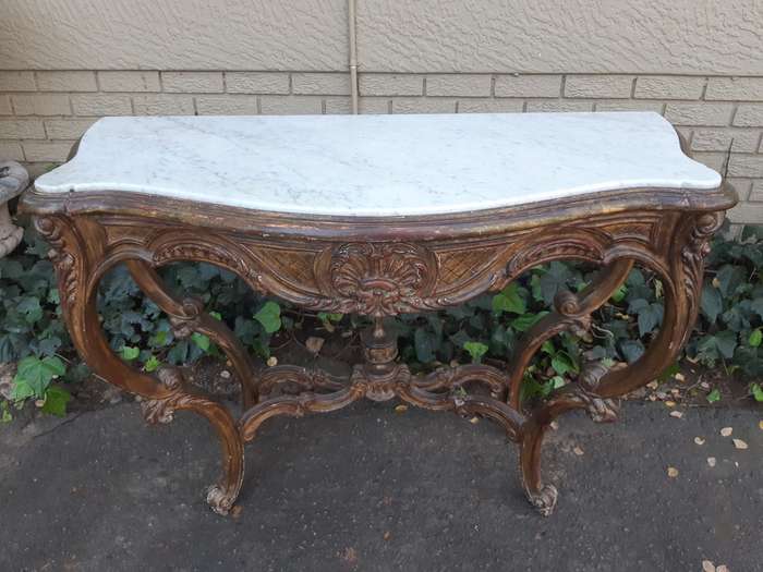 A 19th century French giltwood and marble-topped console table