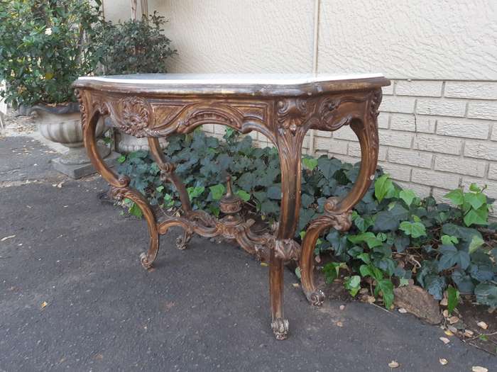 A 19th century French giltwood and marble-topped console table