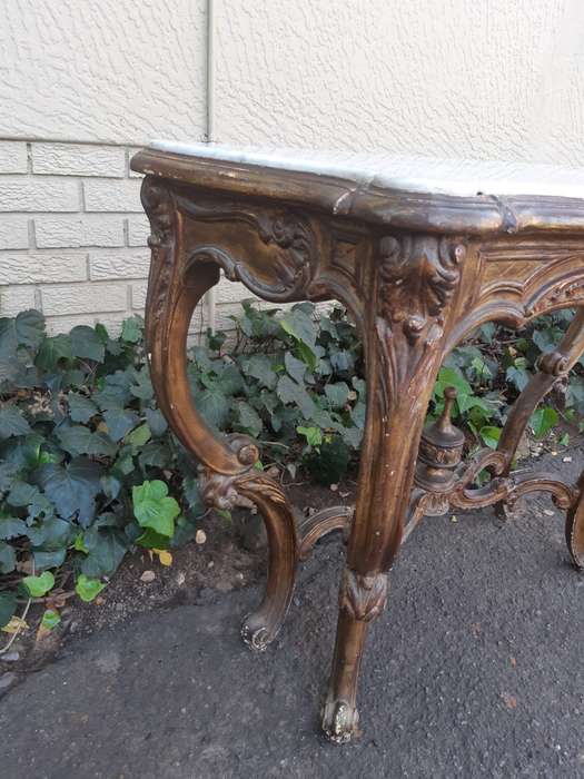 A 19th century French giltwood and marble-topped console table