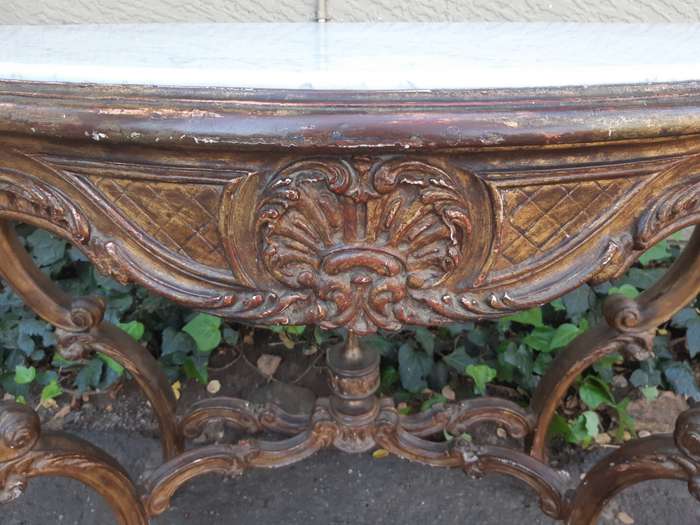 A 19th century French giltwood and marble-topped console table