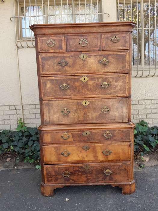 A NEAR PAIR of George III Burr walnut chest-on-chests
