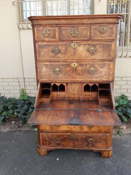 A NEAR PAIR of George III Burr walnut chest-on-chests