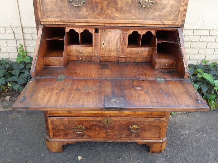 A NEAR PAIR of George III Burr walnut chest-on-chests