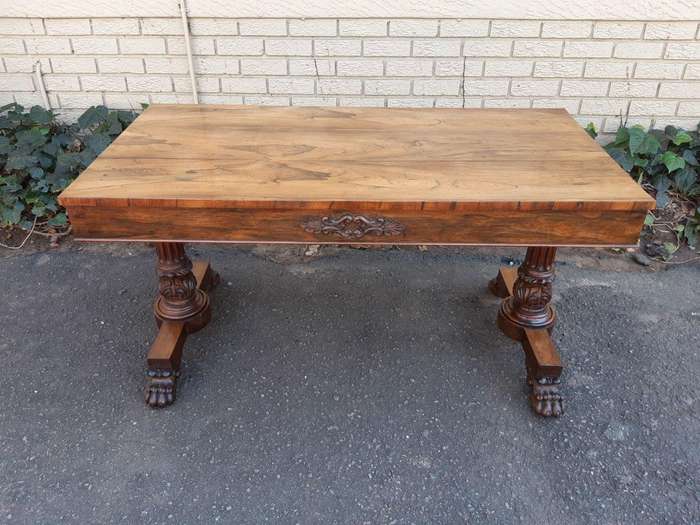 A William IV Rosewood Library Table With Brass Castors