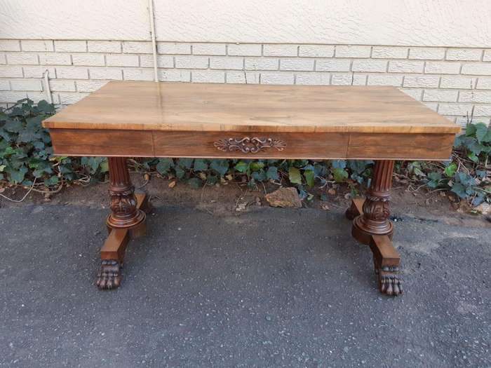 A William IV Rosewood Library Table With Brass Castors