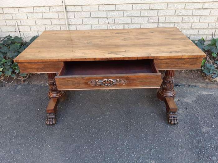 A William IV Rosewood Library Table With Brass Castors
