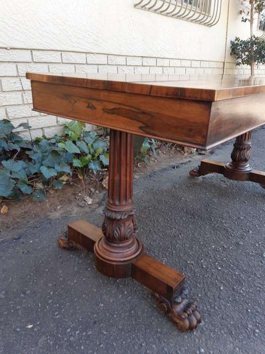 A William IV Rosewood Library Table With Brass Castors
