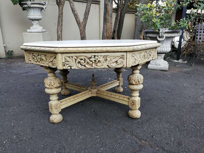 19th Century carved oak octagonal table with five drawers on bun feet