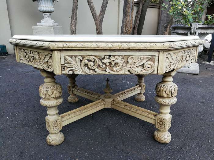 19th Century carved oak octagonal table with five drawers on bun feet