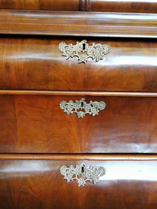 An 18th century (circa 1770) Dutch mahogany cabinet on bombe base/armoire with the original brass...