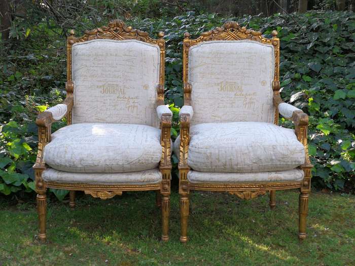 Pair of 19th Century style gilded and carved armchairs
