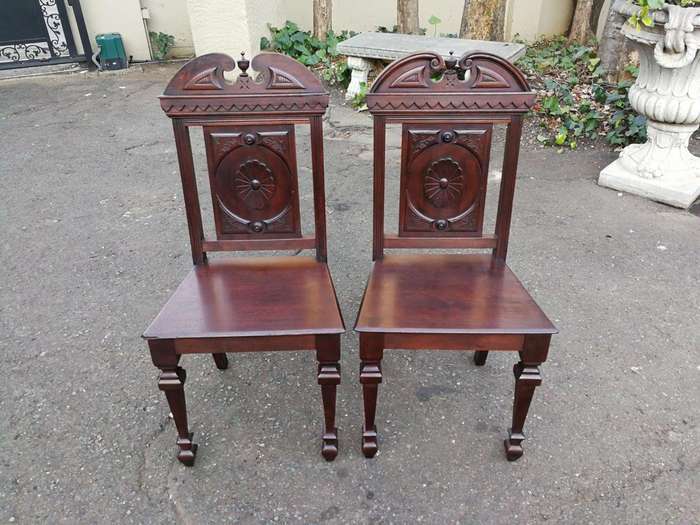 A Pair Of Victorian Mahogany Hall Chairs