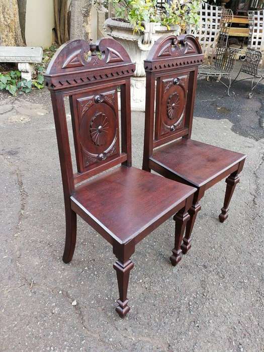 A Pair Of Victorian Mahogany Hall Chairs