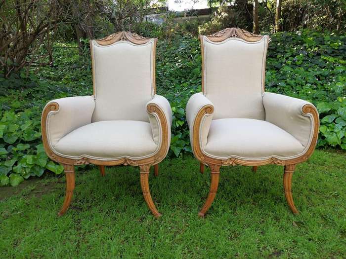 A Pair Of 1920s Bleached / Natural Carved Oak Armchairs upholstered